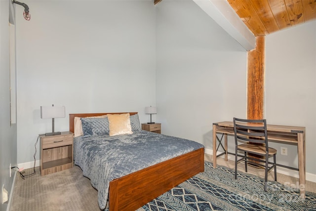 bedroom featuring carpet and wood ceiling