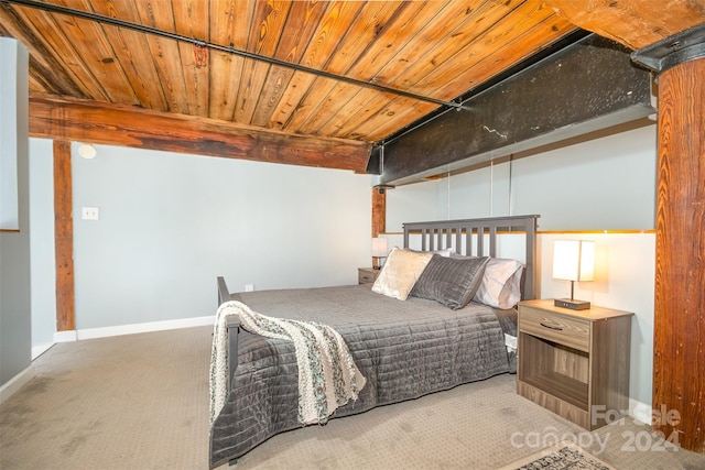 carpeted bedroom featuring wood ceiling