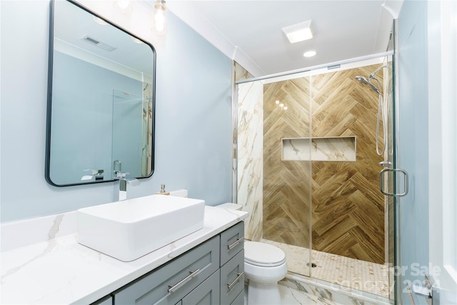 bathroom with vanity, toilet, and walk in shower