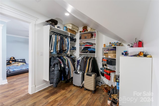 spacious closet featuring hardwood / wood-style flooring