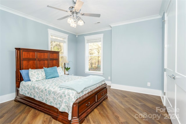 bedroom featuring wood-type flooring, ceiling fan, and crown molding