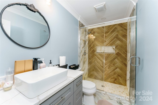 bathroom with vanity, toilet, and walk in shower