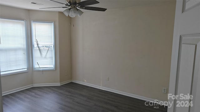 unfurnished room with ceiling fan, dark hardwood / wood-style flooring, and a healthy amount of sunlight