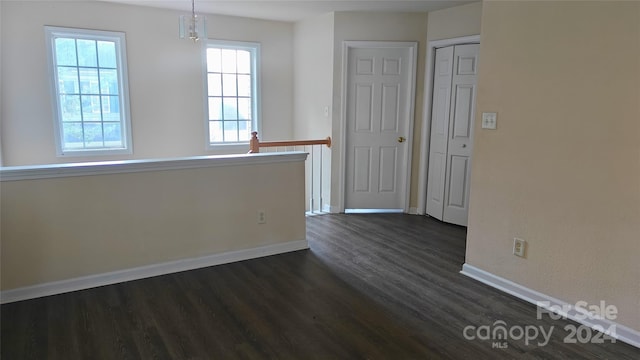 spare room featuring dark hardwood / wood-style floors