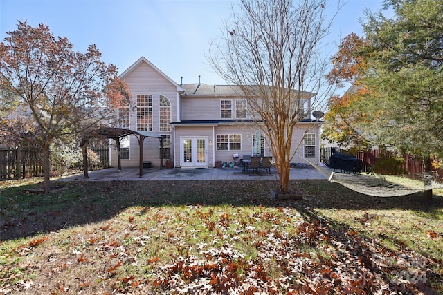 back of house with a lawn, a pergola, a patio, and french doors