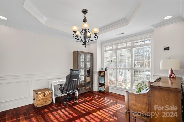 office area featuring dark wood-type flooring, a tray ceiling, crown molding, and a notable chandelier