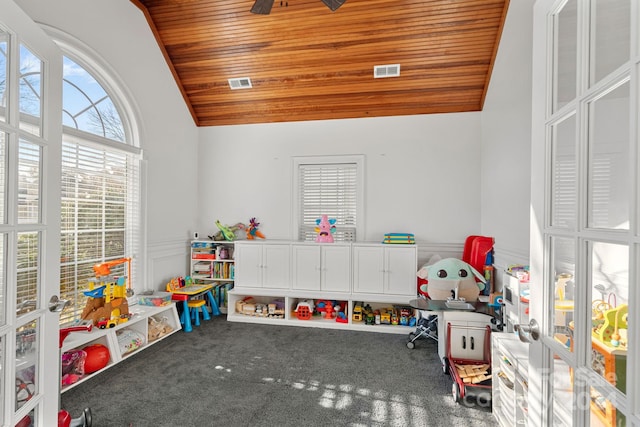 recreation room with carpet floors, vaulted ceiling, and wooden ceiling