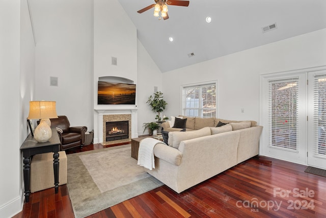 living room with dark hardwood / wood-style flooring, high vaulted ceiling, and ceiling fan