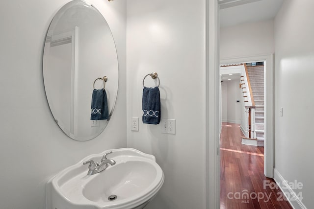 bathroom featuring sink and wood-type flooring