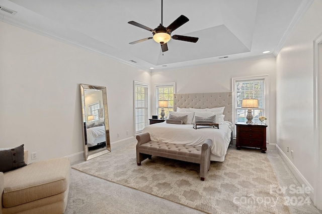 bedroom with light carpet, multiple windows, crown molding, and ceiling fan