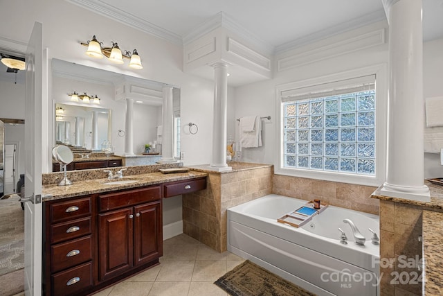 bathroom featuring decorative columns, tile patterned floors, ornamental molding, vanity, and a bath