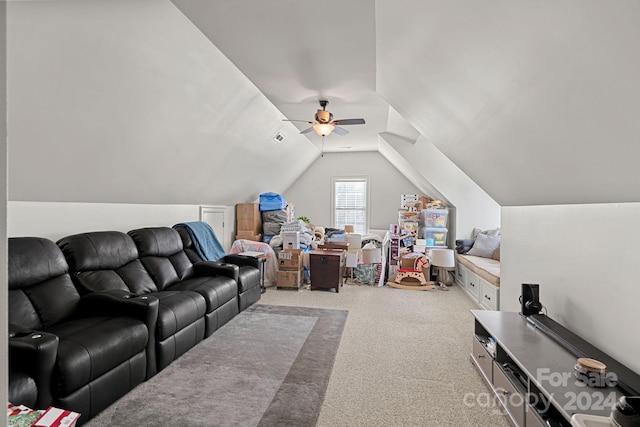 carpeted living room with ceiling fan and lofted ceiling