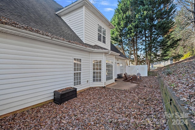 rear view of house with a patio