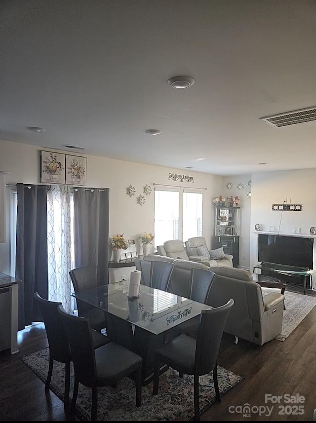 dining area with hardwood / wood-style flooring