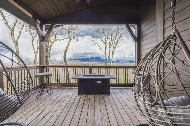 wooden deck featuring a mountain view