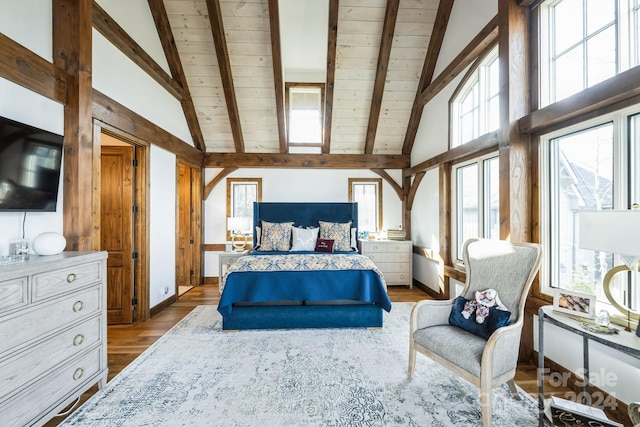 bedroom with beamed ceiling, hardwood / wood-style floors, high vaulted ceiling, and wood ceiling