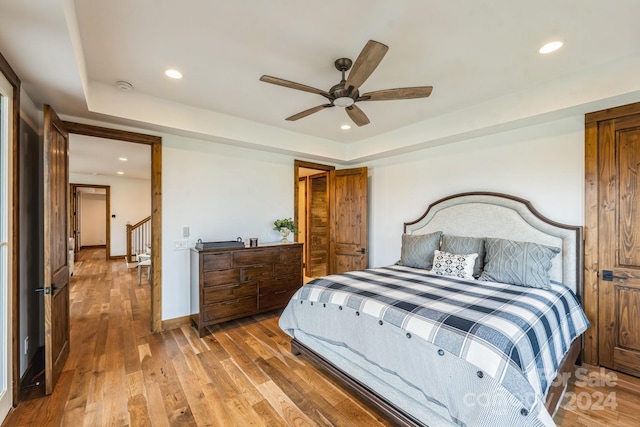 bedroom featuring hardwood / wood-style floors and ceiling fan