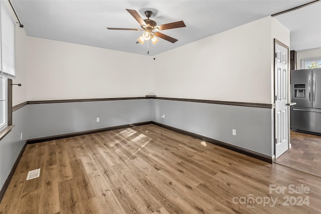 empty room featuring ceiling fan and wood-type flooring