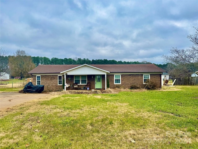 ranch-style home with a front lawn