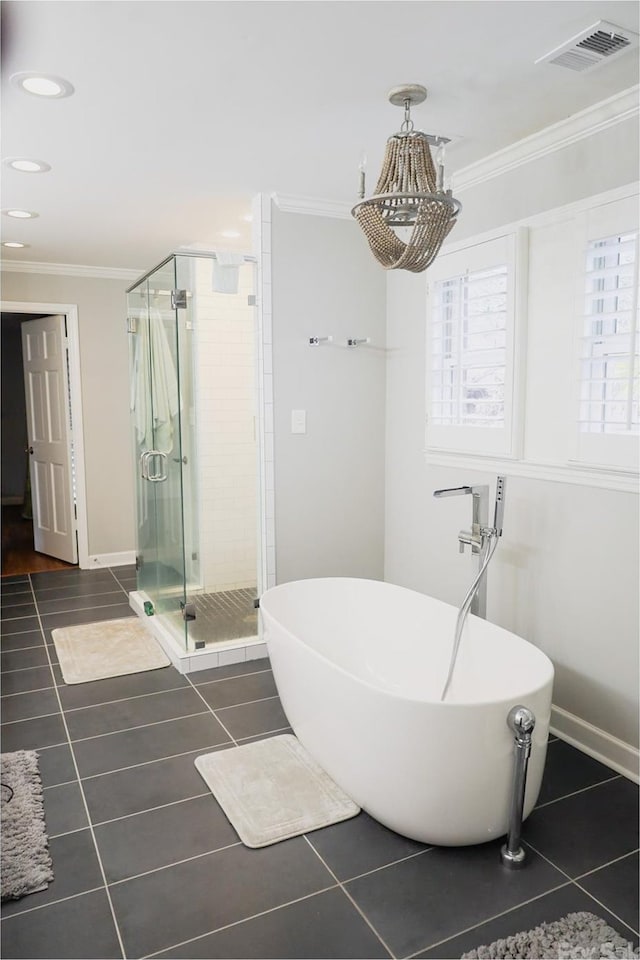 bathroom featuring tile patterned flooring, crown molding, and plus walk in shower