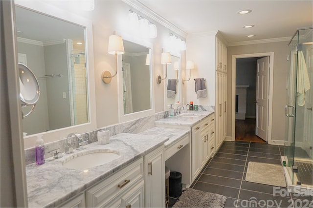 bathroom with crown molding, tile patterned flooring, vanity, and an enclosed shower