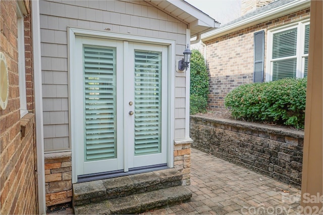 view of exterior entry featuring french doors