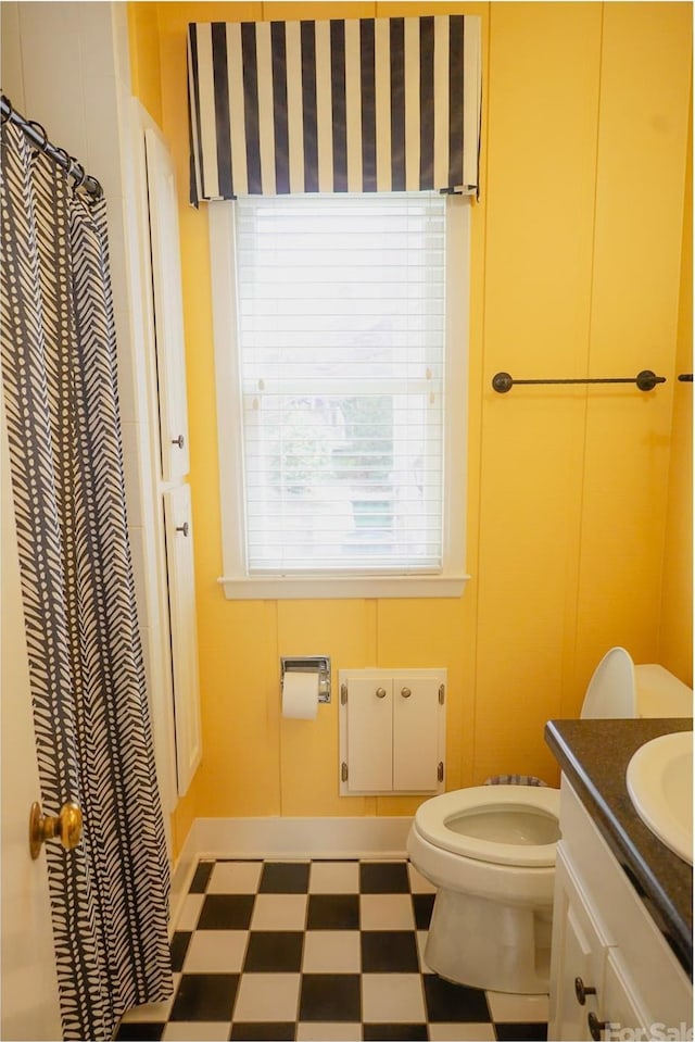 bathroom featuring vanity and toilet