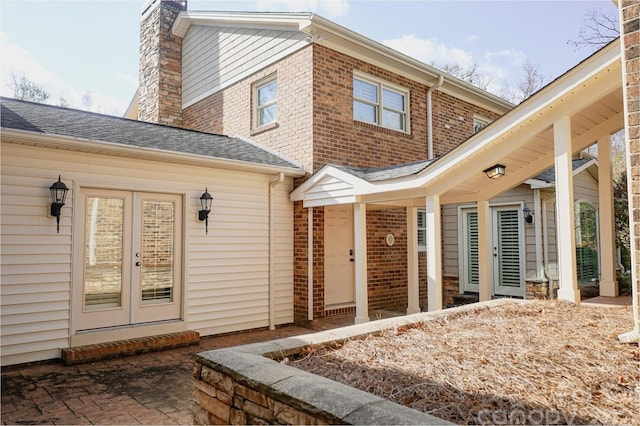 back of house featuring french doors