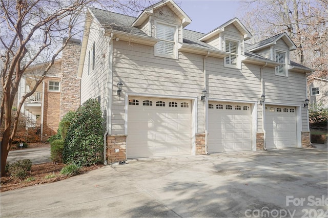 view of property exterior featuring a garage