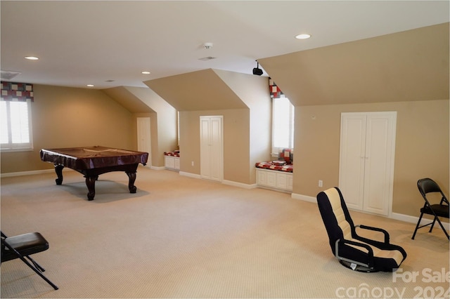 rec room with light carpet, billiards, and vaulted ceiling