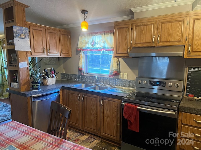 kitchen featuring a textured ceiling, crown molding, sink, and appliances with stainless steel finishes