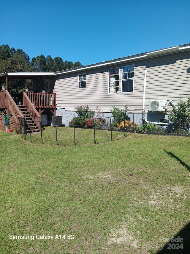 view of home's exterior featuring a deck and a lawn