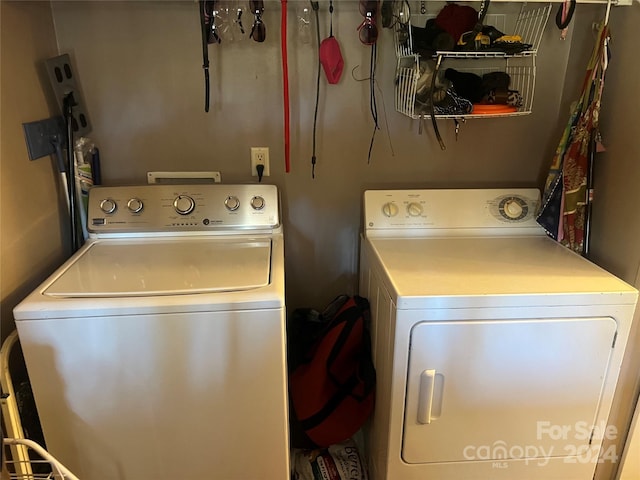 laundry area with washing machine and dryer