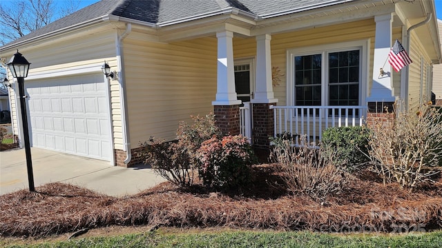 property entrance featuring a garage and a porch