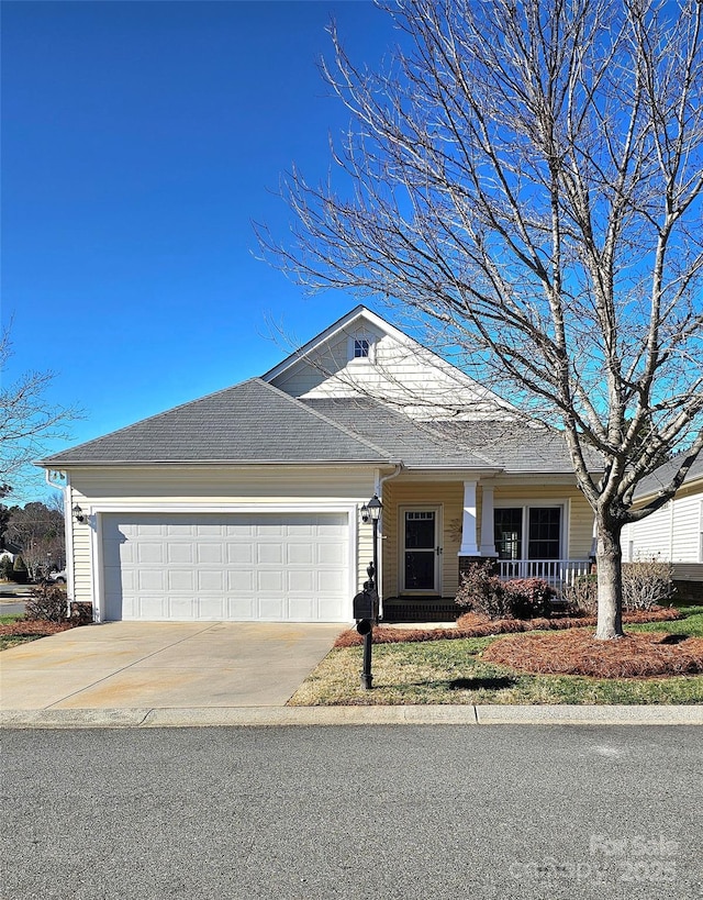 view of front of house featuring covered porch and a garage