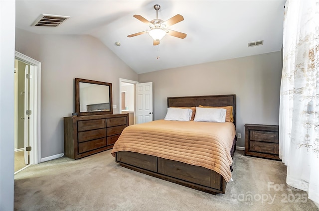 bedroom featuring ceiling fan, light carpet, and vaulted ceiling