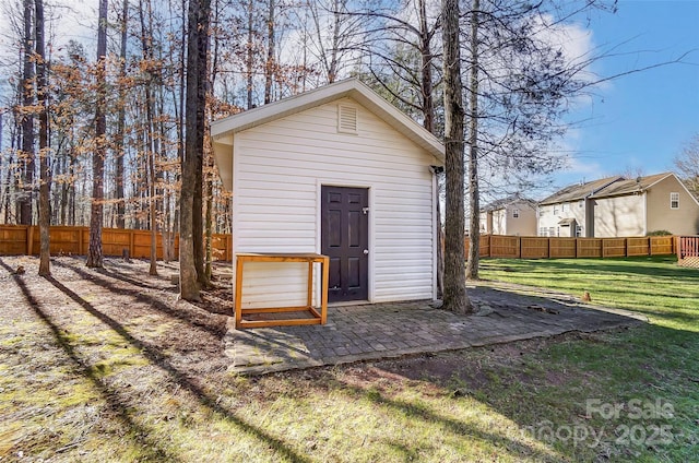 view of outbuilding with a lawn