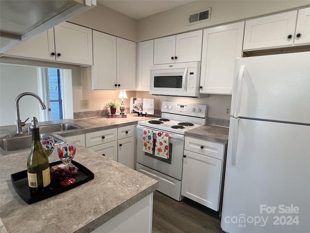 kitchen featuring dark hardwood / wood-style flooring, white appliances, white cabinetry, and sink