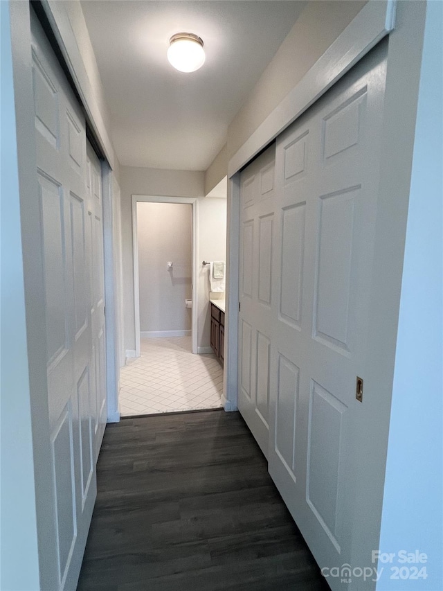 corridor featuring dark hardwood / wood-style floors