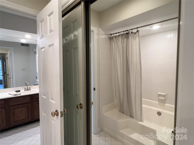 bathroom featuring tile patterned flooring, shower / tub combo, vanity, and crown molding