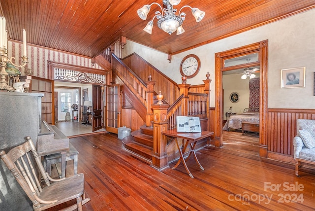 interior space with wooden walls, wood-type flooring, wood ceiling, and french doors