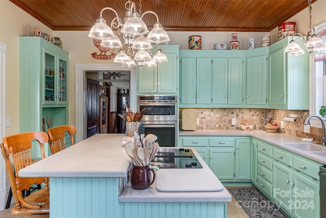 318 N Elm St, Marshville, NC 28103 - kitchen with double oven, ornamental molding, wooden ceiling, a chandelier, and a center island
