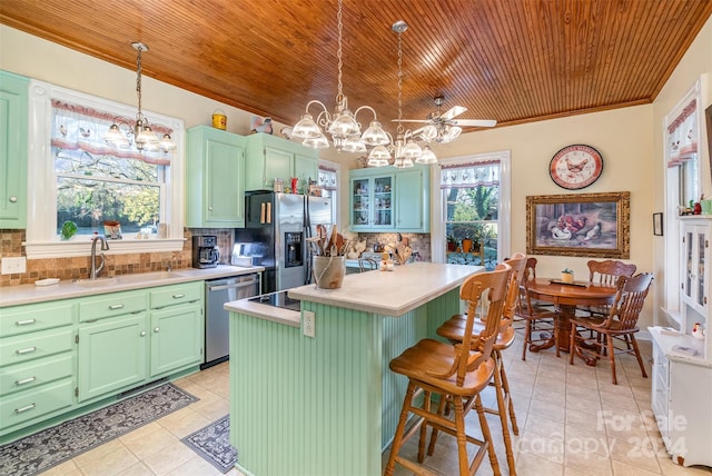 318 N Elm St, Marshville, NC 28103 - kitchen featuring wooden ceiling, appliances with stainless steel finishes, a chandelier, light tile patterned floors, and healthy amount of natural light