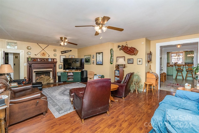 living room with hardwood / wood-style floors and ceiling fan