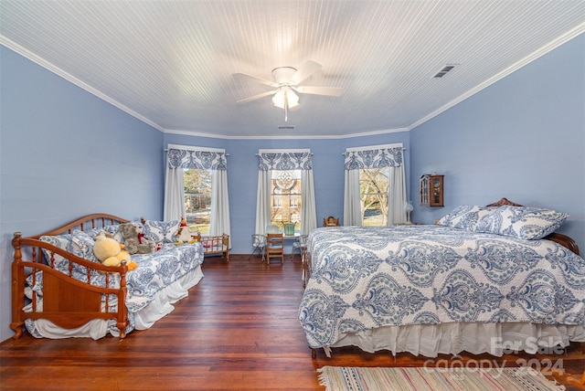 bedroom featuring dark hardwood / wood-style floors, ceiling fan, and ornamental molding