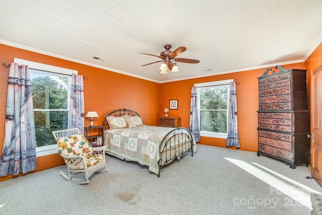 bedroom with carpet, ceiling fan, and crown molding