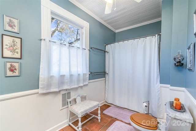 bathroom with ceiling fan, toilet, and crown molding