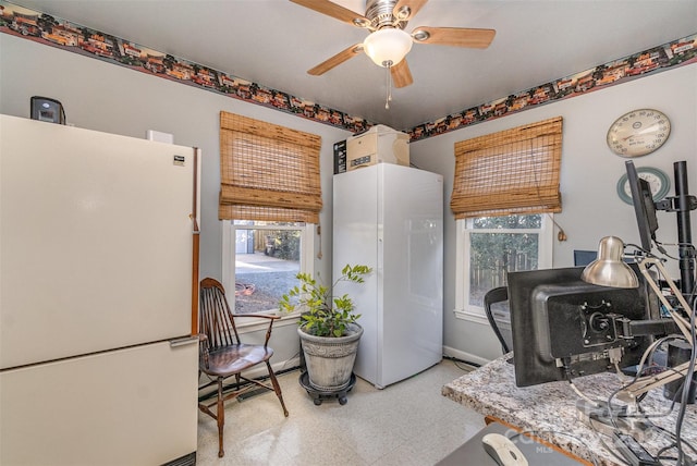 kitchen featuring plenty of natural light, white fridge, and ceiling fan