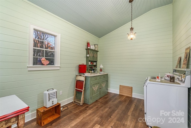 318 N Elm St, Marshville, NC 28103 - kitchen featuring washer / clothes dryer, vaulted ceiling, dark wood-style flooring, wooden walls, and green cabinetry