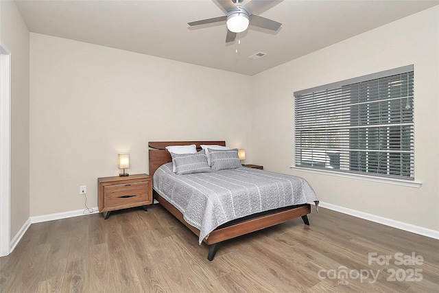 bedroom featuring wood-type flooring and ceiling fan